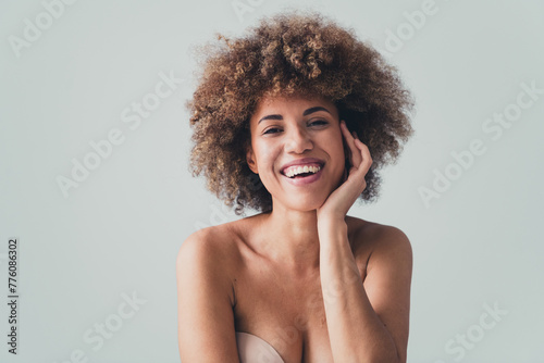 Unretouched photo of smiling girl touch face enjoy soft facial skin after beauty therapy isolated over pastel color background