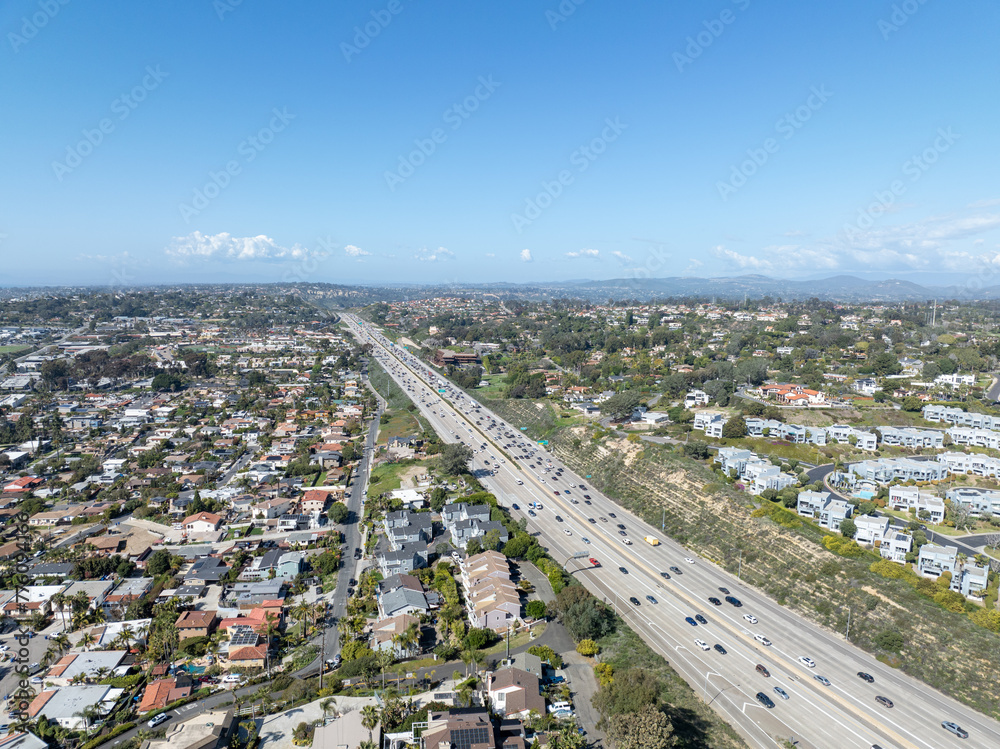 Fototapeta premium Aerial view of highway transportation with small traffic, highway interchange and junction, San Diego Freeway interstate 5, California
