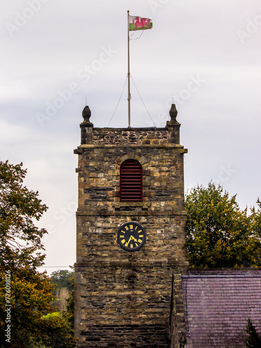 The Tower, built during the Victorian times, of the medieval St Collens Church in Llangollen in Wales on a windy overcast day photo