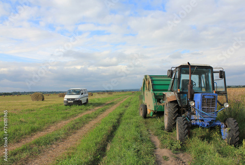 photo, tractor and car in the field. High quality photo