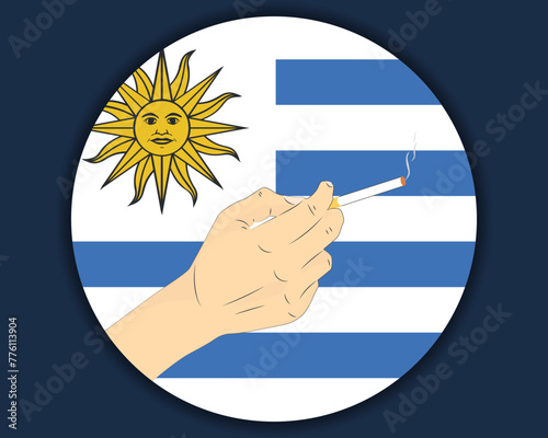 Holding a cigarette with Uruguay flag, smoking and addiction idea