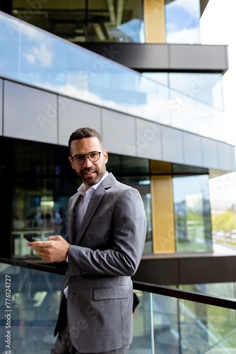 Confident Businessman Smili...