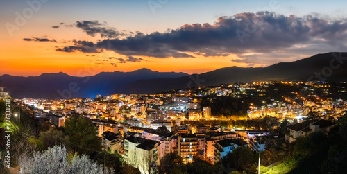 Aerial view of Sanremo town and hills at sunset, Liguria - Italy