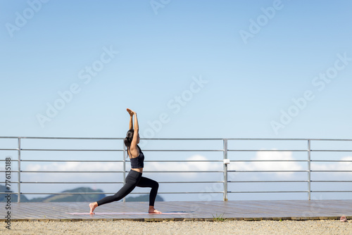 Woman do yoga on over the mountain