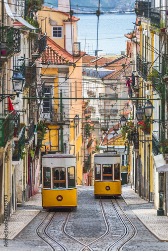 Fotografie Traditional yellow trams, funicular on a street in Barrio Alto, Lisbon, Portugal