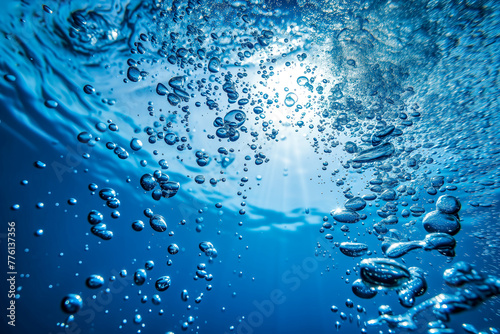 Underwater Clarity: A Close-Up View of Bubbles Ascending in Blue Water