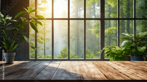 Wooden table sits in front of large window with sunlight streaming through and green plants on the windowsill.