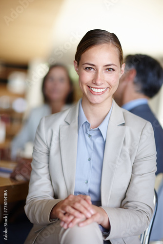 Portrait, woman and happy in office for meeting, company and people for corporate, career and conference. Female person, workshop and smile in workplace with table for seminar, idea and confidence.