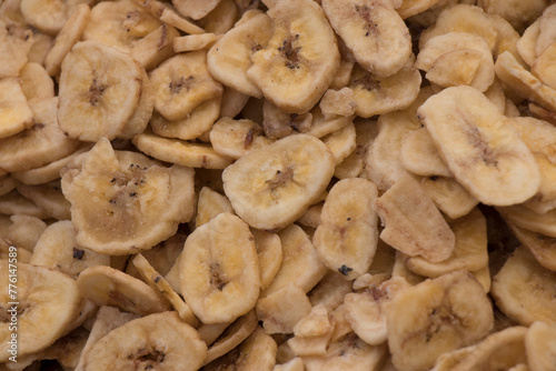 A pile of dried banana pieces on display at a popular market.