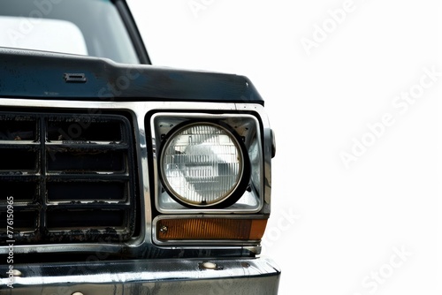 Closeup on headlight of a generic and unbranded pickup truck car on a white background