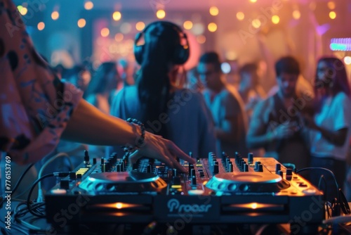 Music DJ set with defocused people dancing at party