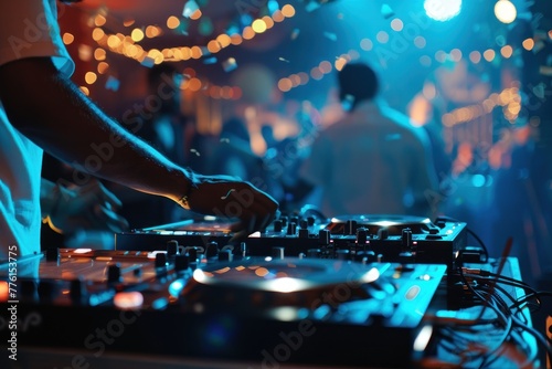 Music DJ set with defocused people dancing at party