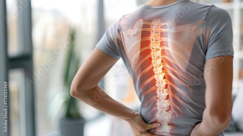 Highlighted Spine of a Woman with Back Pain photo