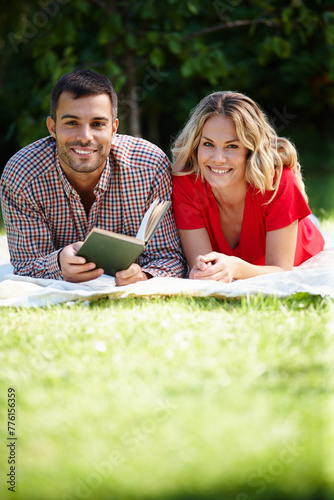 Couple, grass and park with book in portrait for relax, reading or together with notebook. Man, woman and nature for stress relef or break and bonding, chill or picnic and relationship with holiday photo