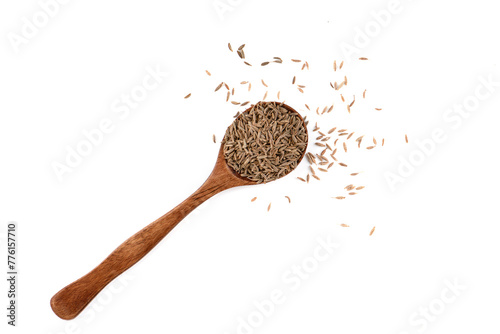 Top view of zira seeds or cumin seeds on a spoon over a white background.