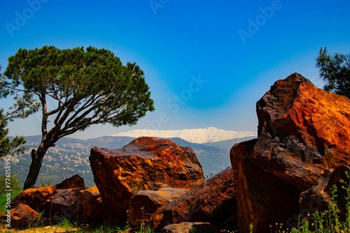 looking at the snow covered Sannine mountain in Lebanon during spring season photo