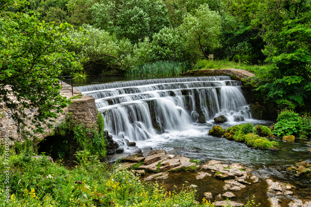 Weir on the river Wye in Monsal Dale in the Peak District in Derbyshire, England