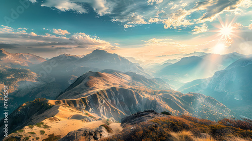 A panoramic view of a mountain range with a sun shining on the peaks © DS Showcase