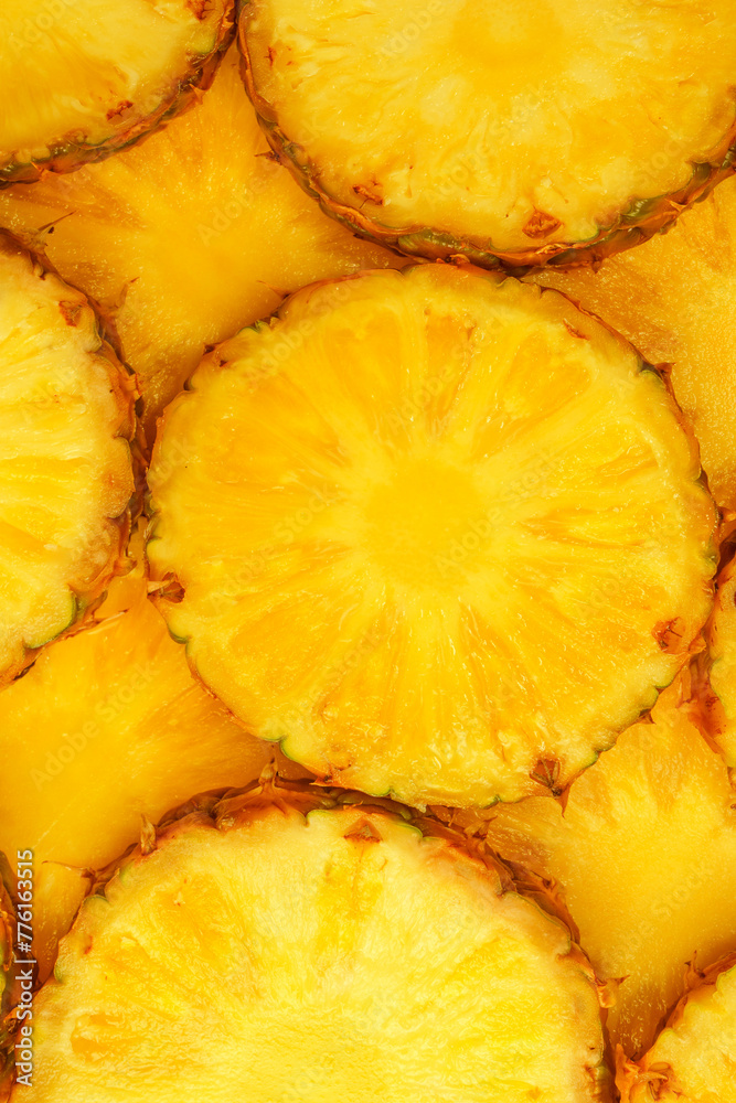 Pineapple juicy yellow slices as a background. Pineapple juicy yellow slices as a background.
