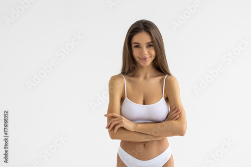 Portrait of happy fit woman isolated on white background
