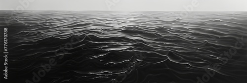 An expansive, smooth surface of a deep black sea, with soft wavelets forming rhythmic ripples, conveying a sense of calm and mystery in the dark waters