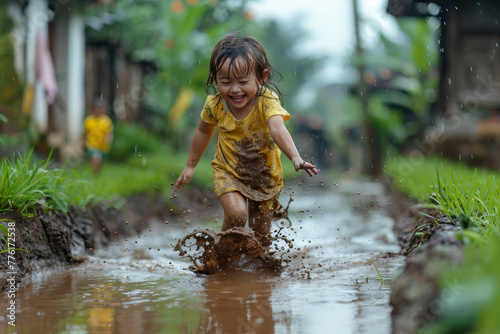 Joyful Child Playing in Mud Puddle.