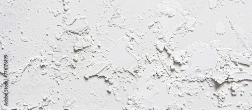 A clock hanging on a white wall