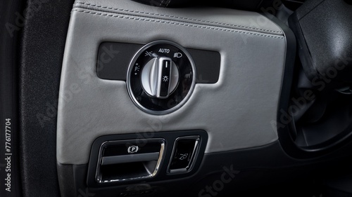 Headlight controls inside of a car photo