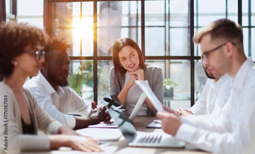Fototapeta premium Employees working at computer together, discussing content