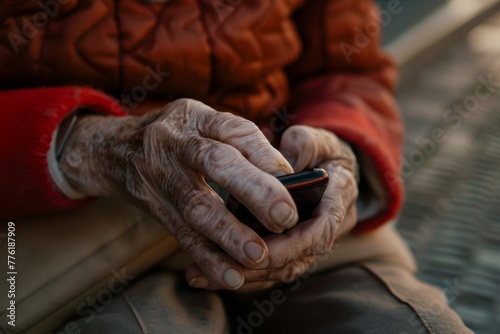 Close-up of elderly hands with a smartphone, showcasing the use of technology by seniors. Elderly Hands Using Smartphone Carefully