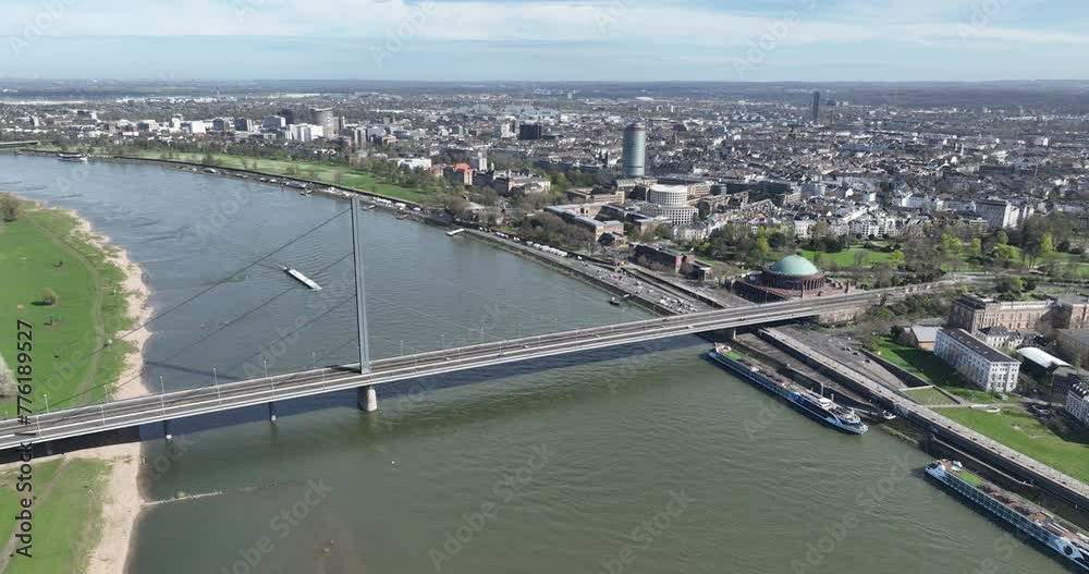 Aerial drone view on the Rheinkniebrucke or Rhine Knee Bridge in Dusseldorf, Germany. Bridge over the Rhine, infrastructure and urban city skyline view. Spring day.
