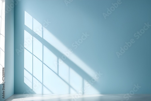 Minimal abstract light blue background for product presentation. Shadow and light from windows on plaster wall.