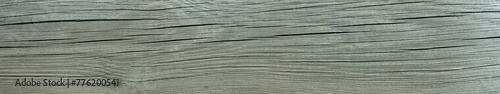 Wide texture of an old weathered cracked wooden board. Natural wide Background.
