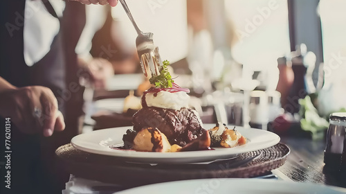 A chef plating a gourmet dish with precision and care.


 photo