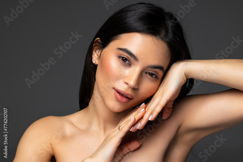 High fashion model metal silver lips and face woman posing in studio,