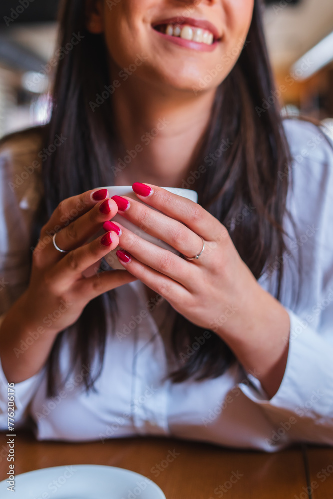 A one young girl or woman is drinking coffee in cafe or restaurant and enjoying her time
A one young girl or woman is drinking coffee in cafe or restaurant and enjoying her time