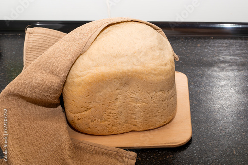 A loaf of freshly baked homemade bread from a bread machine. Cook at home photo