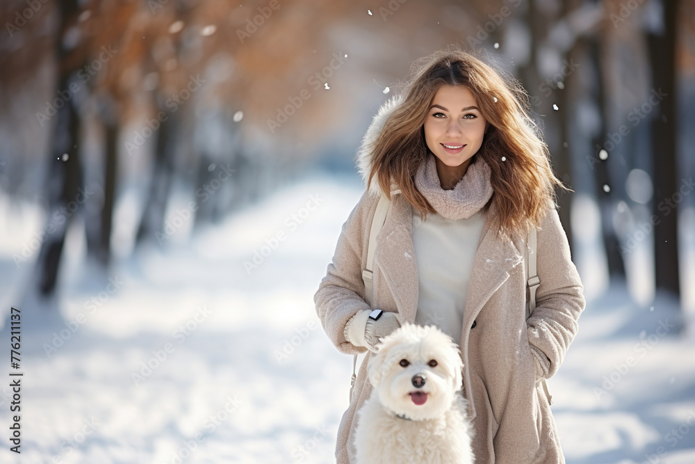 Girl in white walking with her white dog in winter park Girl in white walking with her white dog in winter park