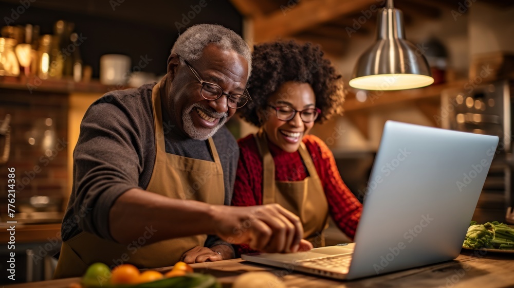 Cheerful Couple Using Laptop at Home Cheerful Couple Using Laptop at Home