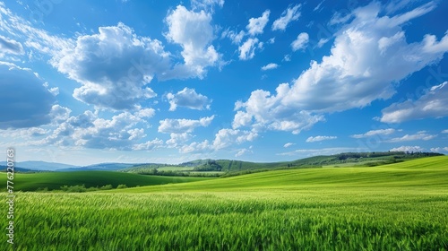 A peaceful countryside vista  where rolling hills meet the azure sky  a serene tableau of rural beauty.