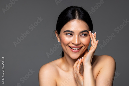 Beauty woman healthy clean skin isolated on dark background