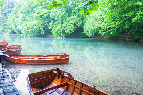 Traditional style wooden rowboats alongside in lake Croatia photo