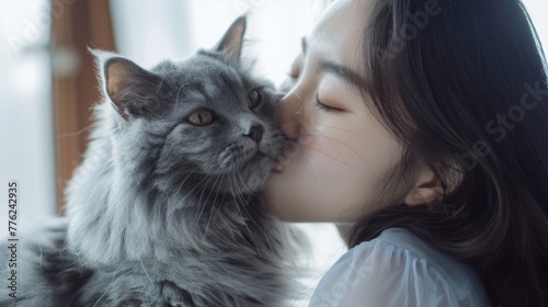 Woman kissing her cute gray Persian cat with love at home generative ai