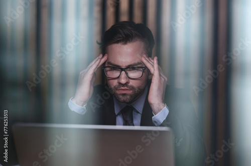 You shouldnt have to think twice about going online. a handsome young businessman sitting behind his laptop in his office. photo