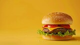 Cheese and Lettuce Hamburger on Yellow Background