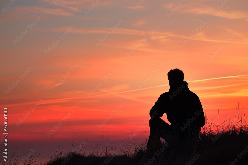 Man sitting on hill at sunset, sport, tranquil scene, relaxation, solitude, grass