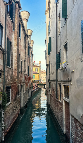 View of water canal and antic building's facades in Venice, Italy. Old historic architecture