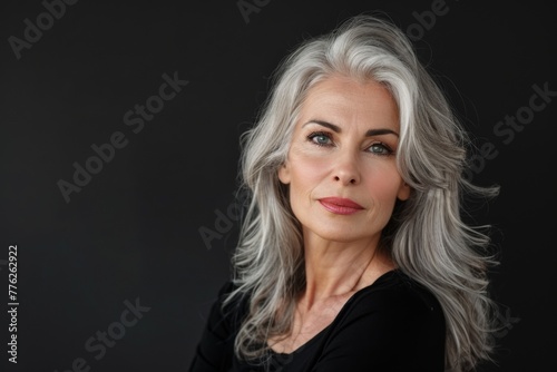 Beautiful middle age woman isolated on the black background.