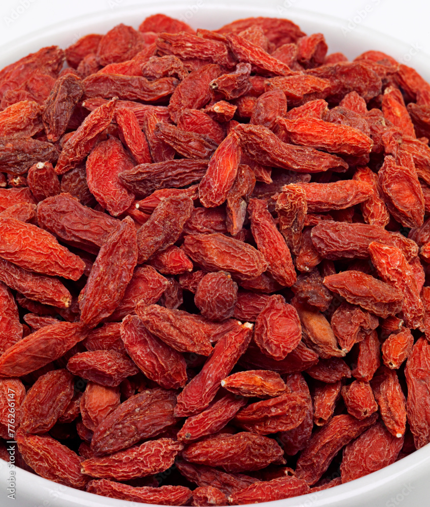 Dried, goji berries and bowl in studio for nutrition, natural, organic and antioxidant as snack for full body. Fresh, fruit and red seeds produce vitamin c, fibre and nutrients for weight loss Dried, goji berries and bowl in studio for nutrition, natural, organic and antioxidant as snack for full body. Fresh, fruit and red seeds produce vitamin c, fibre and nutrients for weight loss