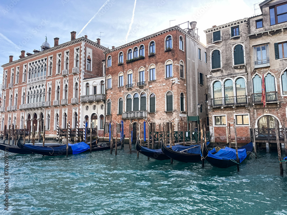 View of Grand canal with old building's facades and gondolas in famous destination Venice, Italy	